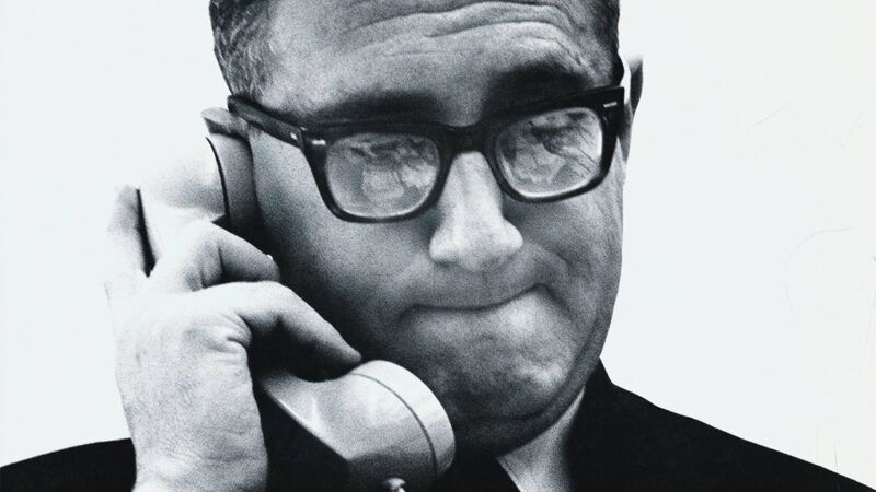 A black and white photo of Henry Kissinger holding a phone to his ear | Photo: Henry Kissinger; Jack Robinson/Condé Nast/Getty