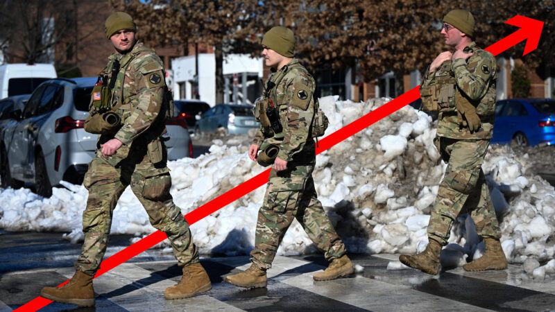 National Guard troops walking scross the street | Illustration: Douliery Olivier/ZUMAPRESS/Newscom