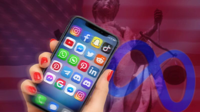 Hand holding an iPhone showing social media apps, with Lady Justice in the background | IMAGO/Frank Hoermann / SVEN SIMON/IMAGO/Sven Simon/Newscom