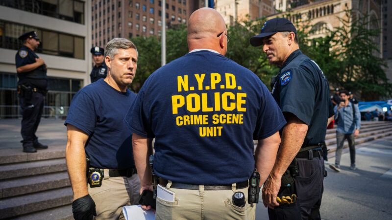 New York Police officers congregate in public; one wears a shirt that sayd "NYPD Police Crime Scene Unit." | Steve Sanchez/Sipa USA/Newscom