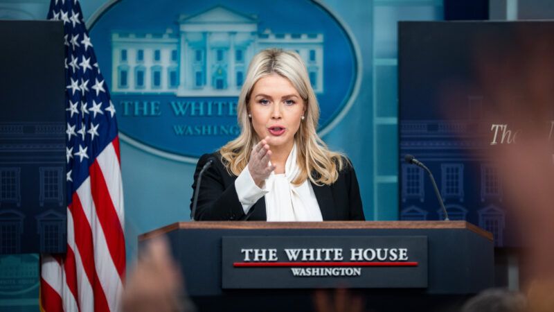 Karoline Leavitt standing at a lectern in the White House briefing room | Sipa USA/Newscom