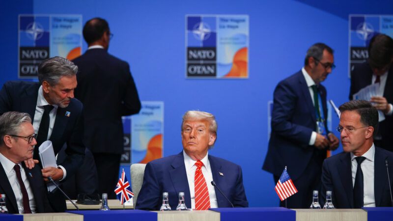 President Donald Trump sits alone among world leaders at a NATO meeting. | Beata Zawrzel/ZUMAPRESS/Newscom