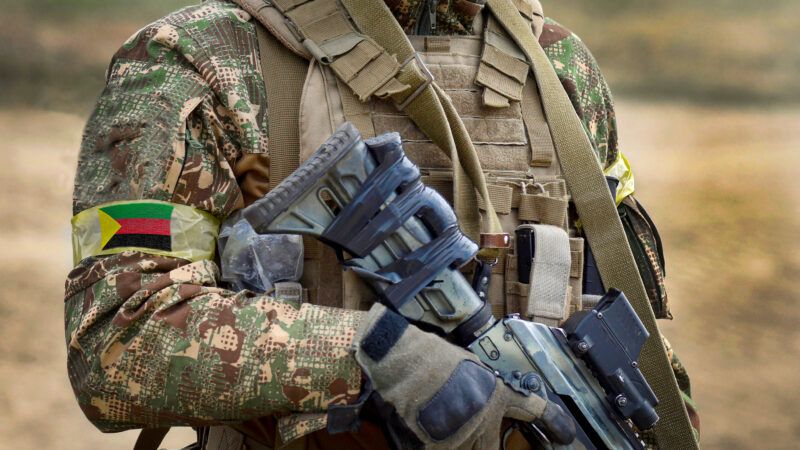 A soldier with a rifle and the flag of Azawad. | Photo: DPST/Newscom