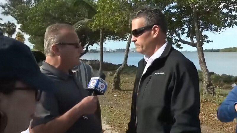 Local 10 News reporter Jeff Weinsier holds a microphone up to Miami-Dade Sheriff's Deputy Lester Aguilar. | WPLG Local 10 via YouTube