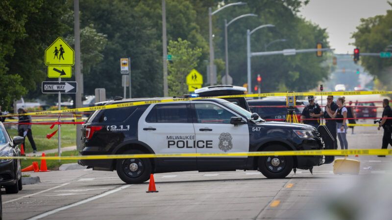 A Milwaukee Police Department vehicle on the road surrounded by crime scene tape | Pat A. Robinson/ZUMAPRESS/Newscom