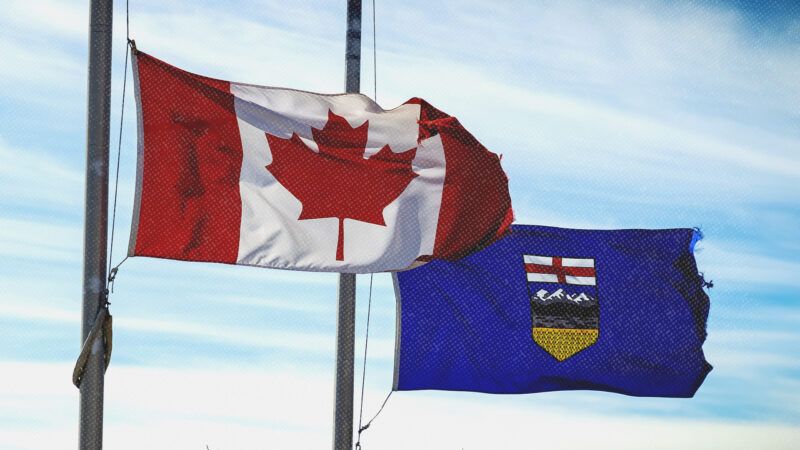 Canadian flag and Alberta flag | Oasisamuel/Dreamstime