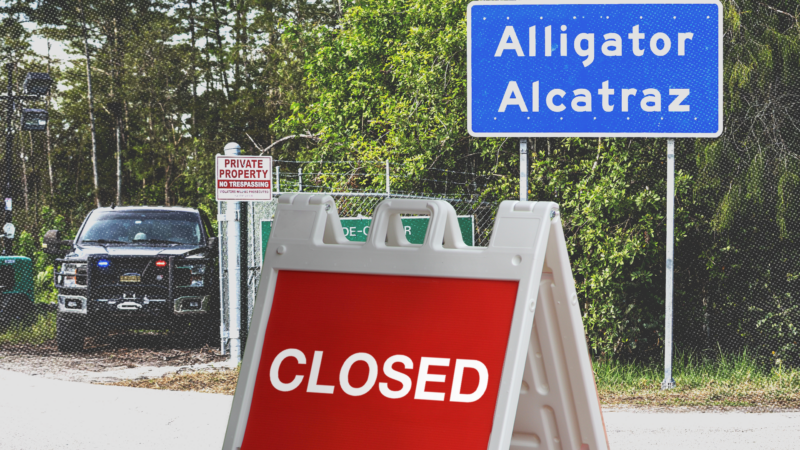 A 'closed' sign in front of 'Alligator Alcatraz' | Dave Decker/ZUMAPRESS/Newscom/Envato