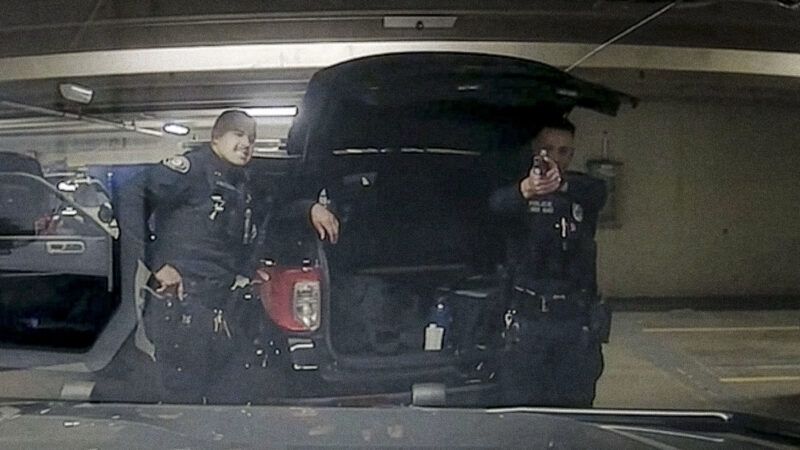 Still image from dash camera footage of Pasadena Police officers engaging in "horseplay" with their guns. | Pasadena Police Department