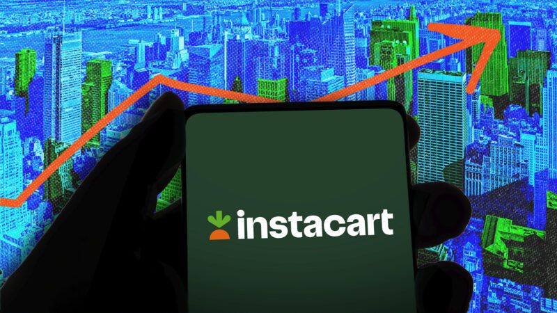A phone with the Instacart logo against a backdrop of New York City | Illustration: Brett Critchley/Dreamstime/imageBROKER/Md Mamun Miah/Newscom