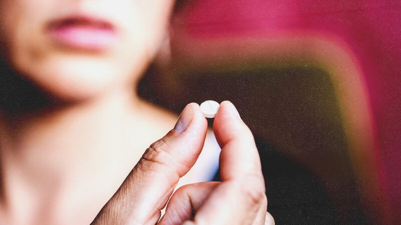 Woman holding an abortion pill | Photo: Astrakanimages/Envato