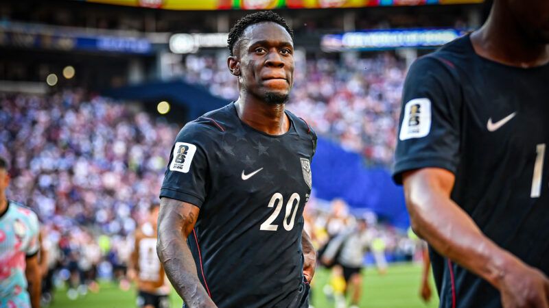 Folarin Balogun walks off the pitch in a navy U.S. soccer jersey, behind a teammate. | Steve Faber/Cal Sport Media/Newscom