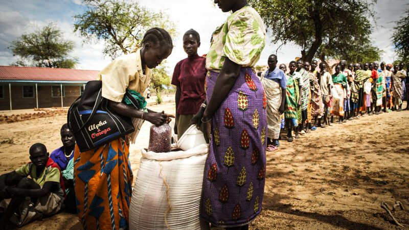 People stand in line for food in Kenya | Komelau/Dreamstime