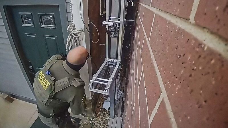 Surveillance camera shows a Border Patrol agent outside a home | Institute for Justice
