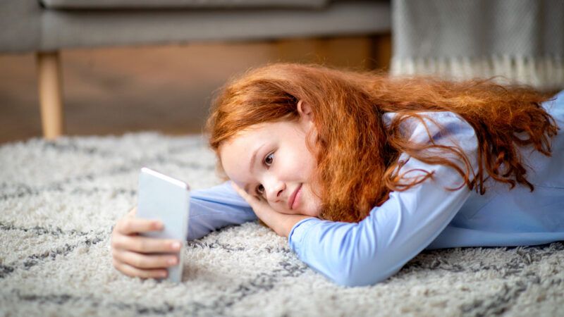 Teenager using a smartphone | DPST/Newscom