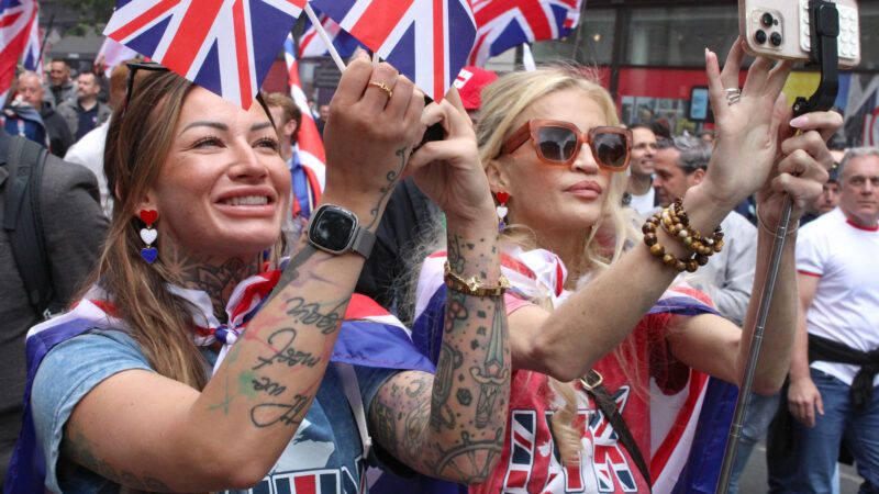 Citizens waving British flags in the street | Teun Voeten/Sipa USA/Newscom