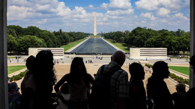 silhouettes of tourists looking at the Lincoln Memorial Reflecting Pool | Jemal Countess/UPI/Newscom