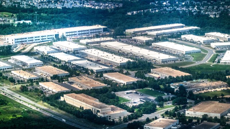 Aerial view of a dense cluster of data centers, including facilities under construction. Aerial perspective of Ashburn, Virginia. | John Mcadorey/Dreamstime