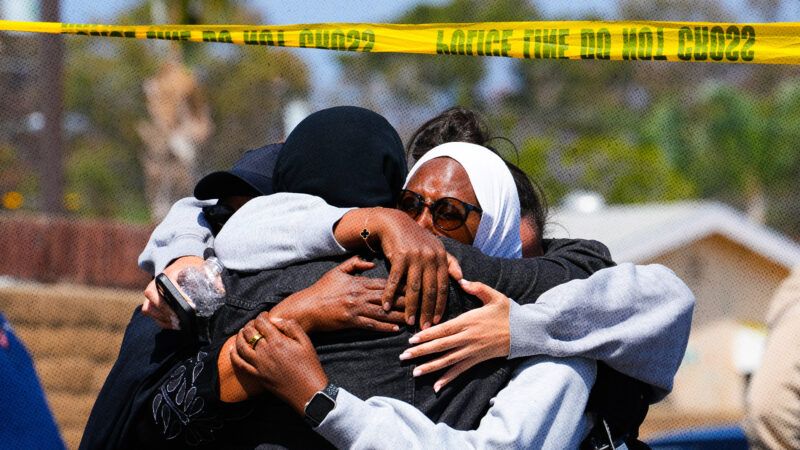 Congregants embrace each other after a shootiing at a San Diego mosque | Nelvin C. Cepeda/Zuma Press/Newscom