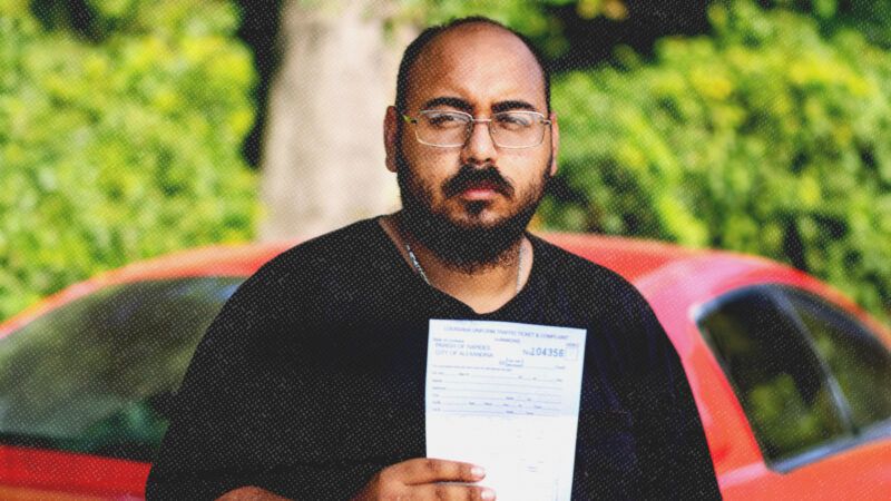 Mario Rosales holds a citation he received after a traffic stop in Alexandria, Louisiana | Institute for Justice