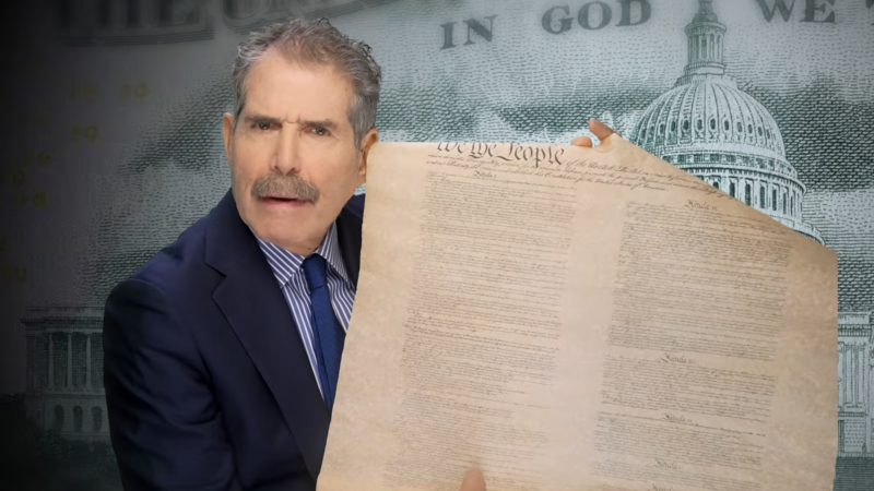 John Stossel holds a copy of the U.S. Constitution | John Stossel