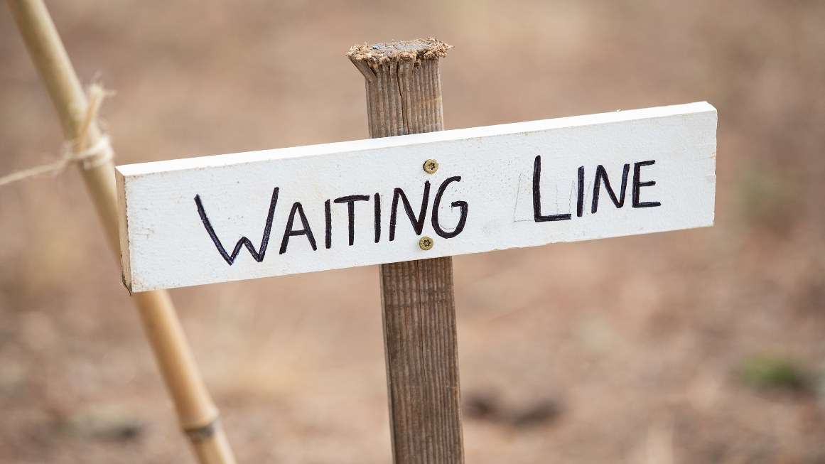 System wait. Waiting in line. Bettlejuice waiting line. Take a line sign.