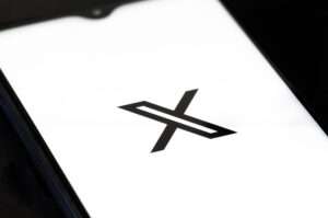 A smartphone screen with the logo for X (formerly Twitter). | Michele Ursi | Dreamstime.com