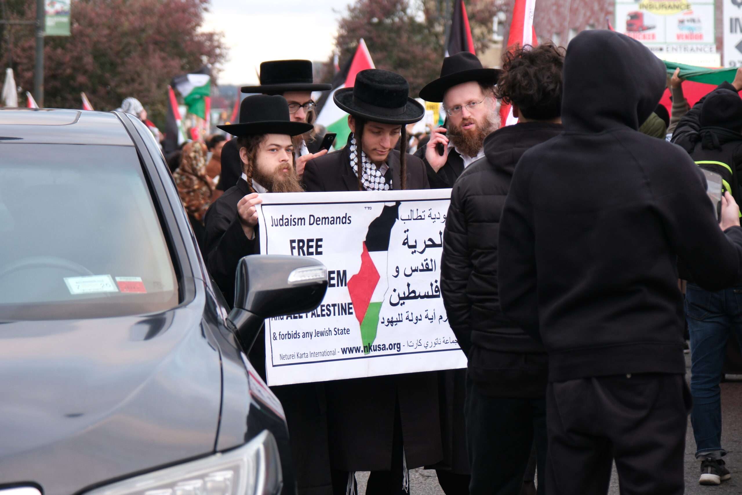 Members of the fundamentalist Jewish group known as Neturei Karta marched at the front of the protest.
