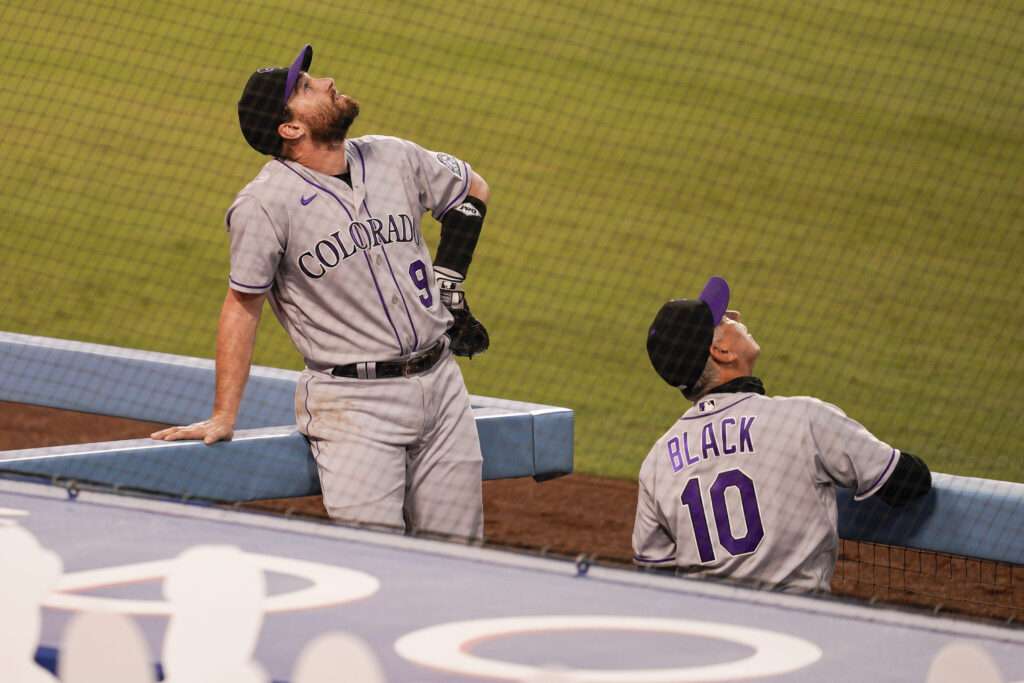 Colorado Rockies first baseman Daniel Murphy (9) and manager Bud Black look up at the drone in the sky that delayed a MLB game between the Colorado Rockies and the Los Angeles Dodgers on September 4, 2020 at Dodger Stadium in Los Angeles, CA.