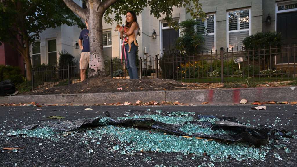 Photo: Sabel Harris, an advisory neighborhood commissioner, pictured next to broken auto glass from break-ins in Washington, D.C.; Michael S. Williamson/The Washington Post/Getty
