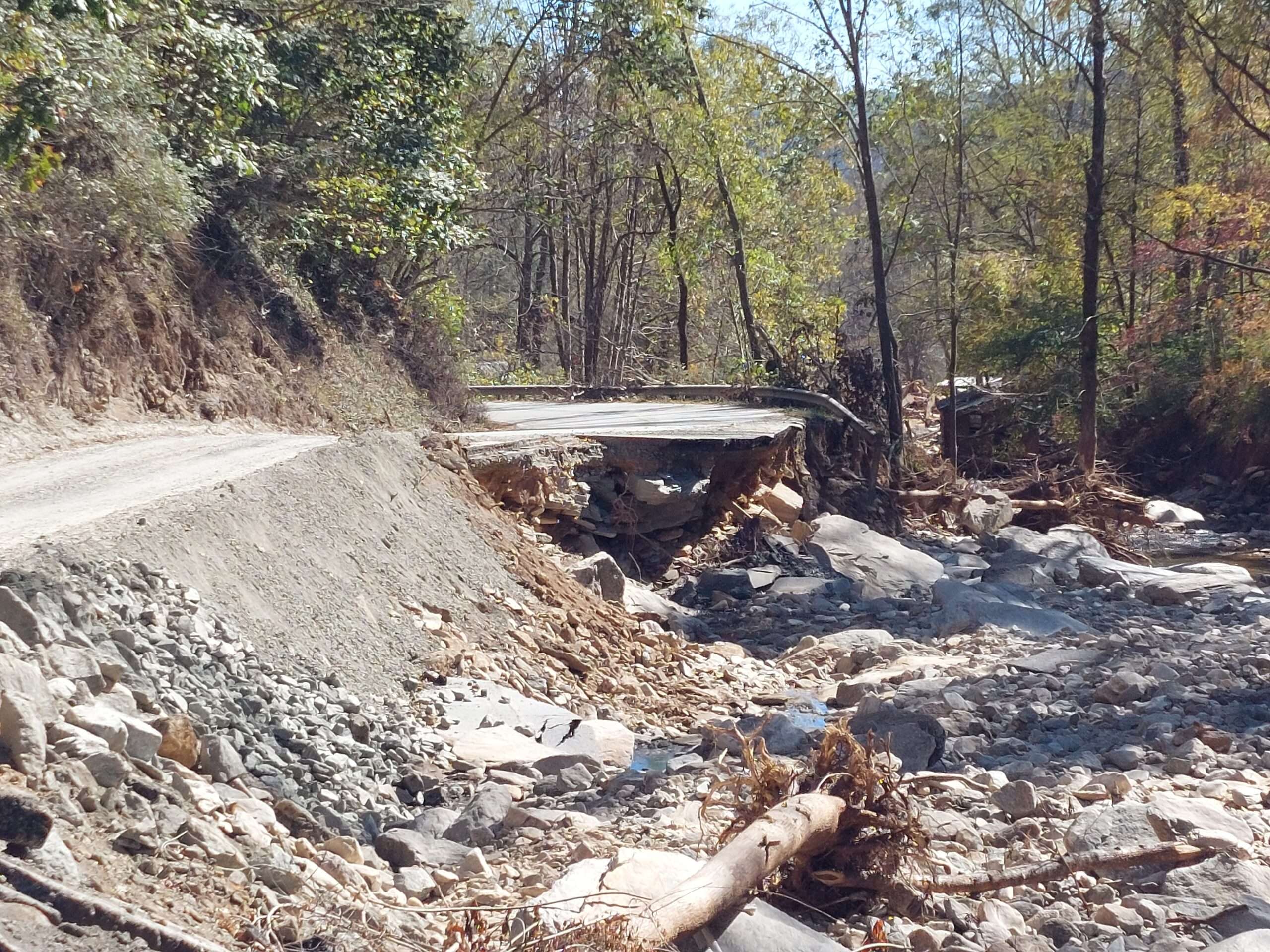 Flooding washed out sections of U.S. Route 74, slowing relief efforts.