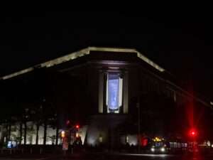 A banner featuring Donald Trump is seen hanging on the Justice Department