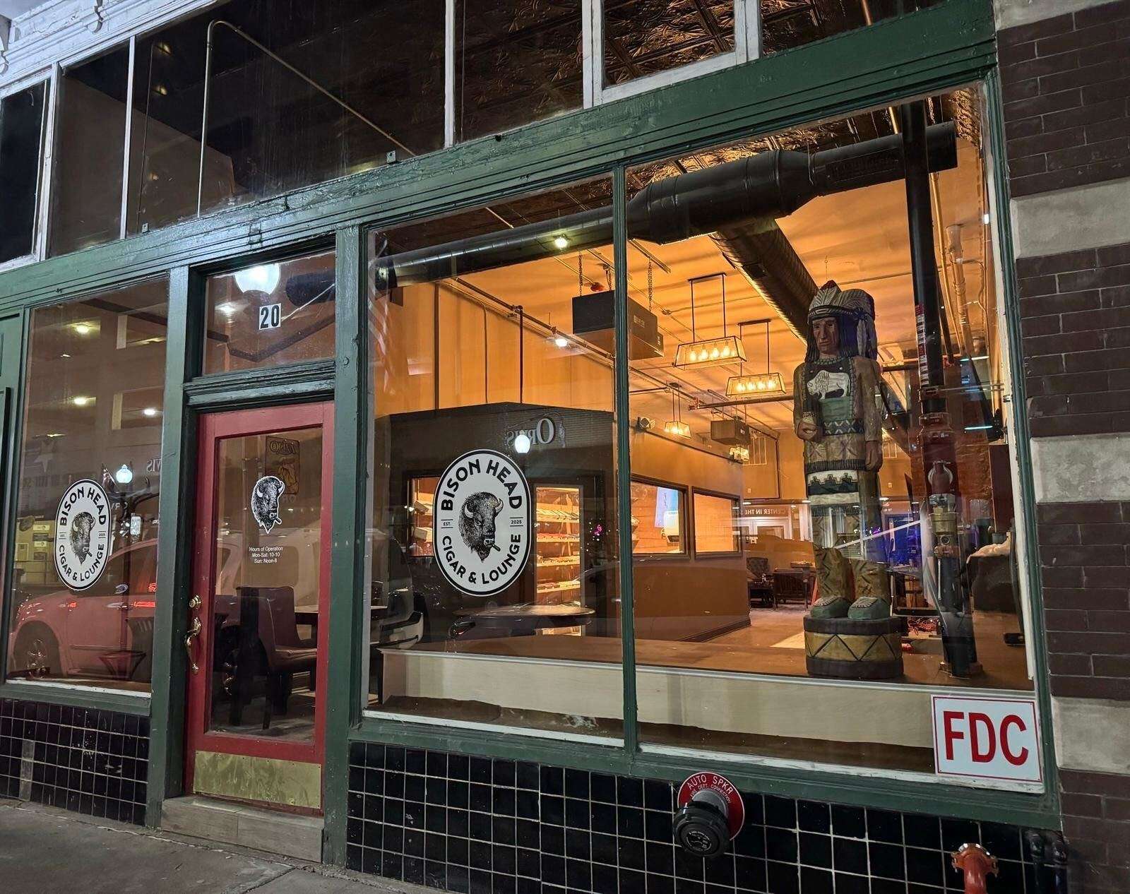 A window storefront for Bison Head Cigar & Lounge