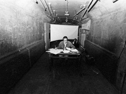 At the Avant Garde Festival in 1973. John Cage writes in a baggage car during the Avant Garde Festival in New York City, December 1973