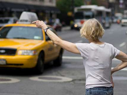 A woman hailing a taxi cab