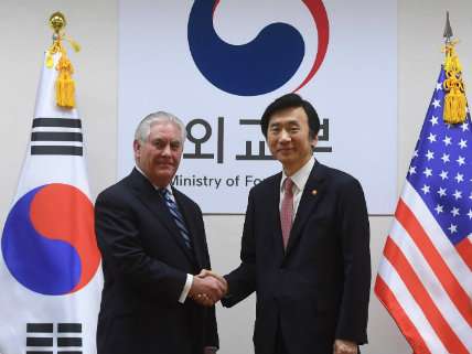South Korean Foreign Minister Yun Byung-se (R) shakes hands with U.S. Secretary of State Rex Tillerson in South Korea on March 17