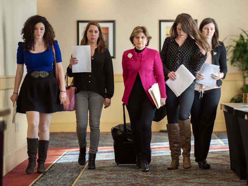 Lawyer Gloria Allred walks with several of the students behind a 2013 Title IX complaint filed with the Office for Civil Rights against the University of Connecticut