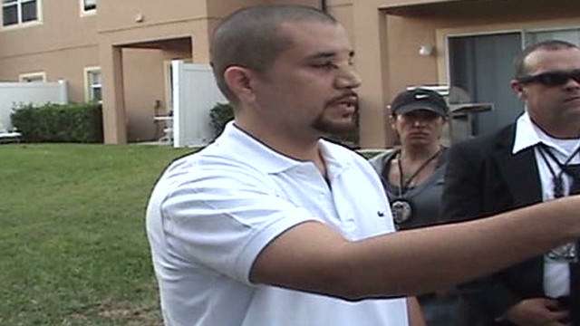 Zimmerman returns to the scene of the shooting with police.