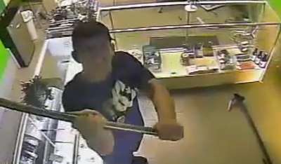 Undercover cop smashing pot shop's camera