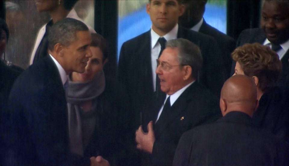 OMG, they touched! I hope Obama got his cootie shot first.
