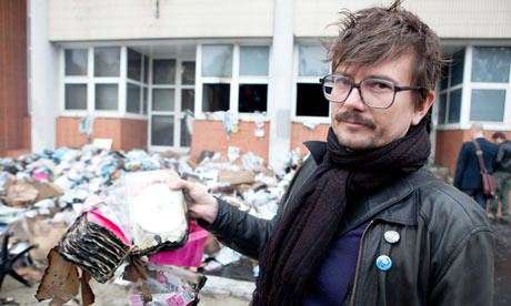 From their previous firebombing. This cartoonist, Luz, survived today's attack because he overslept.