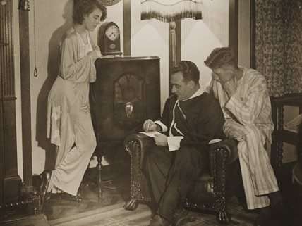 Archive photo of family gathered around the radio