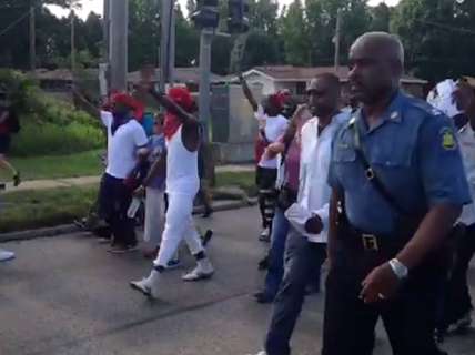 Highway Patrol Chief following along with protesters