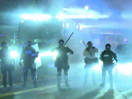 Ferguson police within tear gas