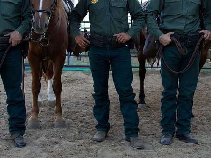 Border patrol agents with horses