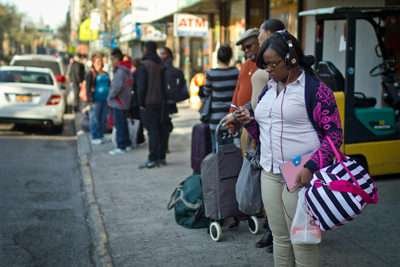 Passengers wait for a bus from New York City to Washington, D.C. ||| Jim Epstein