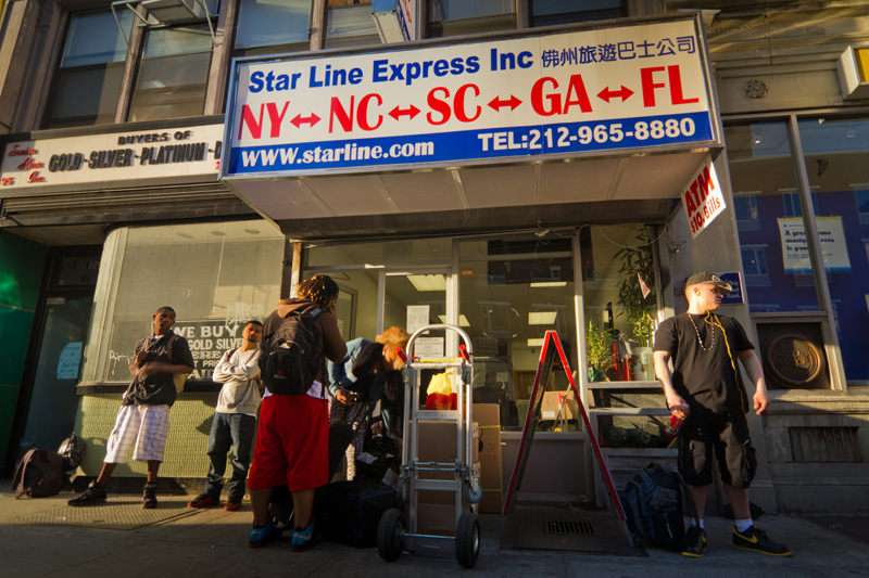 Customers wait for a bus that will take them from New York City to Tampa for $90. ||| Credit: Jim Epstein