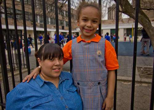 Annaly Lopez with her daughter Renee outside Success Academy ||| Credit: Jim Epstein