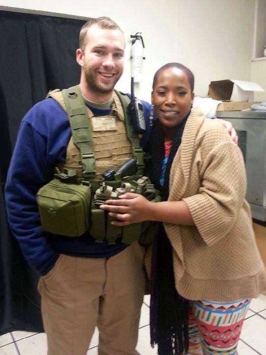 On the left, one of the Oath Keepers' volunteers. On the right, the owner of a business he's helping protect.