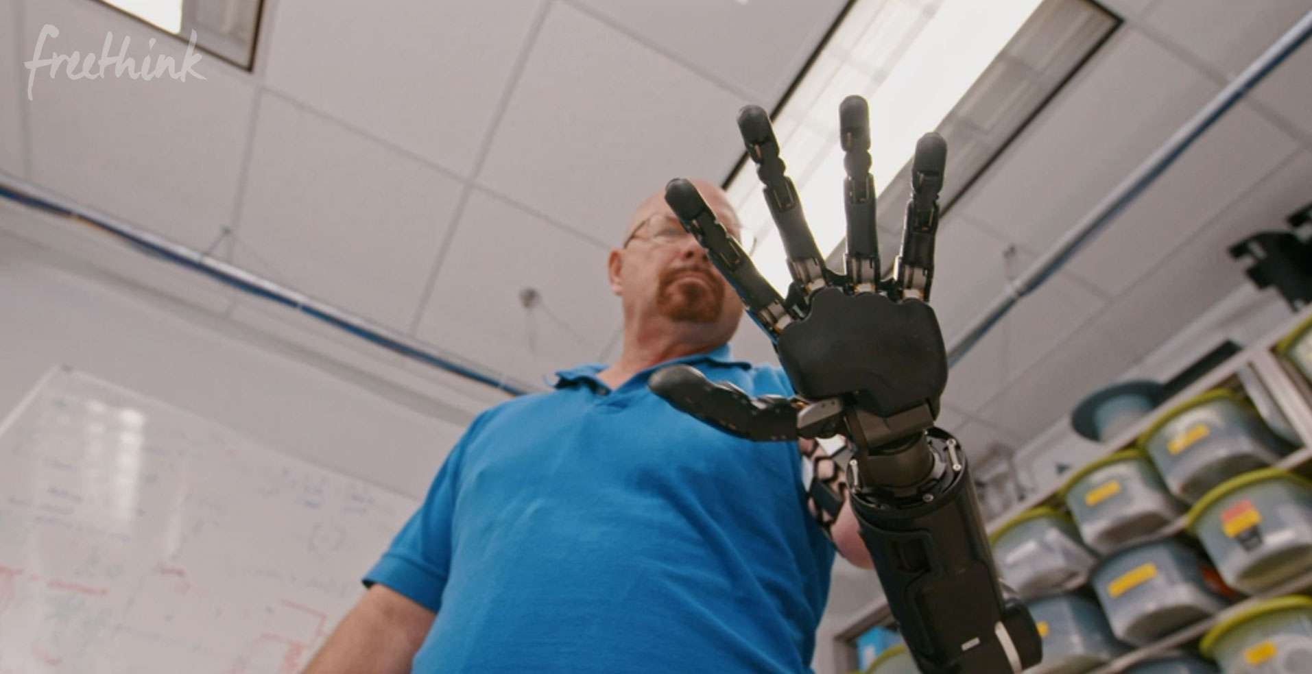 Johnny Matheny gazes at the bionic arm that replaced the limb he lost to cancer in a documentary produced by Freethink Media.