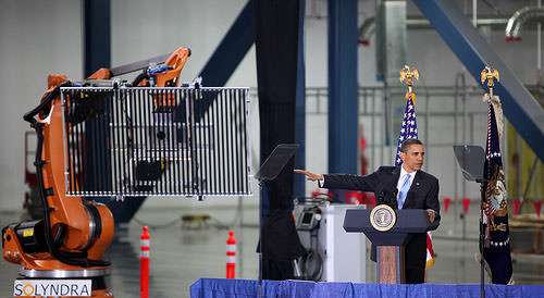 President Obama poses with Solyndra product. 